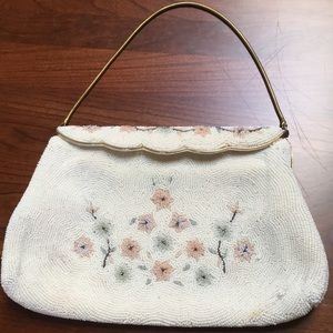 Beaded clutch with small metal handle